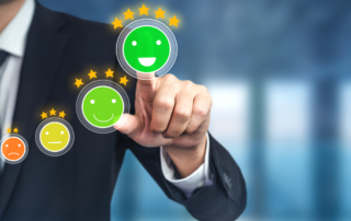 customer selecting happy face in customer experience survey